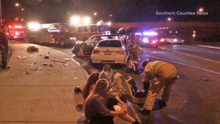 Authorities respond to the intersection of Pacific Coast Highway and Newport Boulevard in Newport Beach Sunday, Nov. 17, 2013.