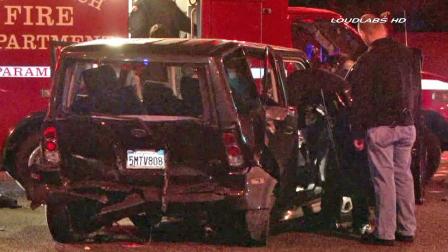 A wrecked vehicle is shown at the scene of a hit-and-run crash in Long Beach on Friday, Nov. 22, 2013.