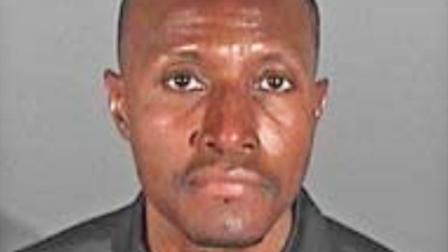 Travis Darren Rutherford, 47, is shown in a booking photo from the El Segundo Police Department. Rutherford was arrested for allegedly stealing wallets from shopping carts at grocery stores.