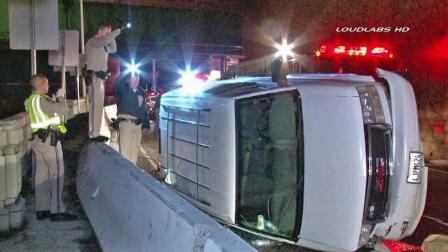 California Highway Patrol officials respond to the scene of a fatal single-vehicle accident on the 110 Freeway northbound connector to the 5 Freeway in Lincoln Heights Saturday, Nov. 30, 2013.