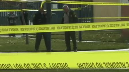 Authorities investigate after a man was found dead inside an apartment in the 37800 block of 20th Street East in Palmdale on Sunday, Dec. 8, 2013.