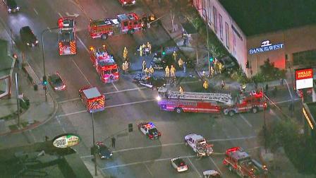 Fire engines and other emergency vehicles are shown near the site of a violent car crash near Ventura Boulevard and Oakdale Avenue in Woodland Hills on Thursday, Dec. 27, 2013.