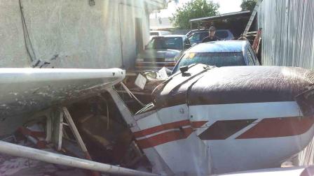 A single-engine Cessna 172 plane crashed into a parking lot across San Fernando Road near Whiteman Airport in the Pacoima area of Los Angeles Sunday, Dec. 29, 2013.