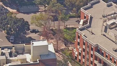 An apparent gang-related shooting victim was found near a gate at the USC campus on Wednesday, Feb. 12, 2014.