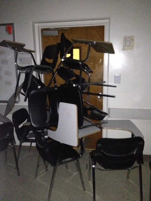 CSUF students barricaded the door to their class with desks during a search for two possibly armed suspects on campus on Wednesday, Dec. 12, 2012.