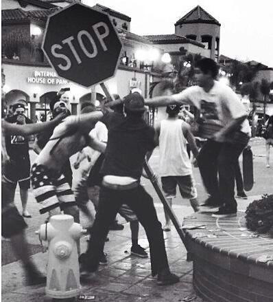 A crowd tears down a stop sign during what...