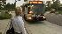 Woman waits for bus in Orange County