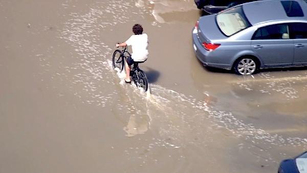 The high tide flooded a parking lot at Balboa Pier, closing off the area to cars and beach goers on Wednesday, Aug. 31, 2011.