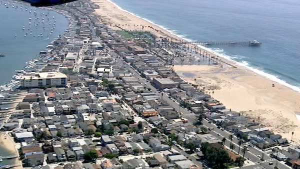 The high tide flooded a parking lot at Balboa Pier, closing off the area to cars and beach goers on Wednesday, Aug. 31, 2011.