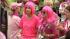 Participants wear pink wigs in support of breast...
