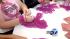 Participants hold beads at the Susan G. Komen...