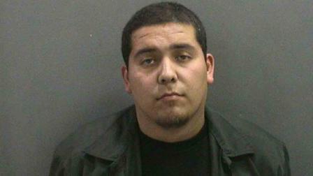 Salvador Alvizar, 24, appears in a booking photo provided by the Orange County Sheriffs Department.