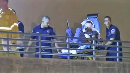 A man is taken into treatment after being injured from illegal fireworks in Huntington Beach on Wednesday, July 4, 2012.
