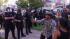 Police and protesters meet during a protest that turned violent on Tuesday, July 24, 2012, over two recent fatal shootings by police in Anaheim.