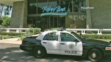 A Fullerton police vehicle is shown outside of a Robbins Brothers in Fullerton, which was broken into on Saturday, July 28, 2012.