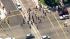 A group of protesters make their way through...