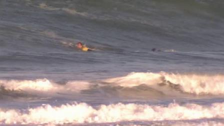 Lifeguards are seen searching for a missing swimmer in the Dana Point area on Monday, Sept. 3, 2012.