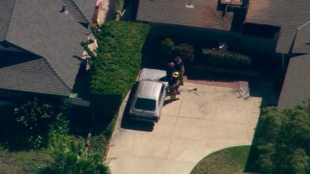 Firefighters are shown at the scene of a fire at a home in the 1700 block of West Loretta Lane in Santa Ana on Friday, Sept. 7, 2012.