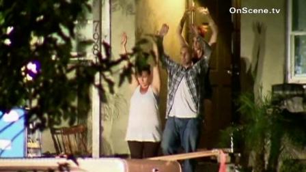 People are seen walking out of a house where authorities found a suspected meth lab.