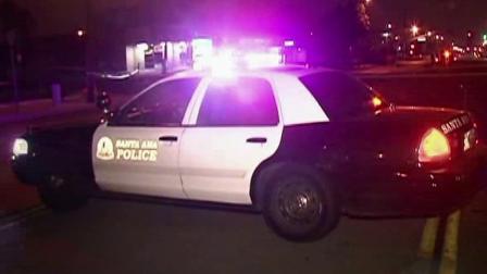 A police patrol car is parked at the scene of a fatal hit-and-run in Santa Ana on Thursday, Sept. 13, 2012.