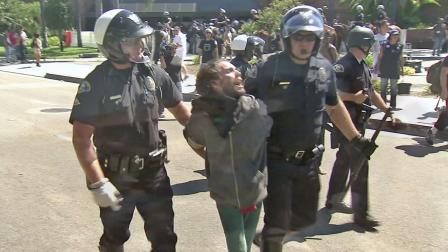 Anaheim police officers detain a man in this undated file photo.