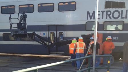 A crane fell over and blocked a Metrolink train in Santa Ana on Tuesday, Oct. 2, 2012.