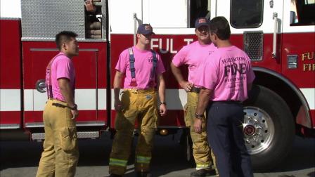 Fullerton firefighters wear pink to raise awareness for breast cancer and cancer research.
