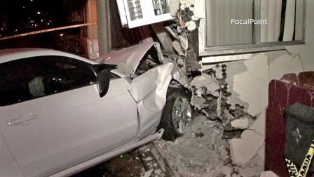 A car is shown after it rammed into an apartment building in Anaheim on Saturday, Oct. 27, 2012.