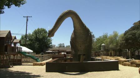 A lifelike, 40-foot long dinosaur statue at the Zoomars Petting Zoo is seen in this undated file photo.