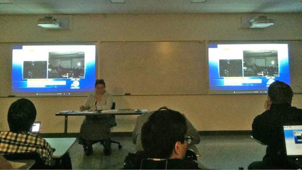 A classroom is seen watching ABC7 for information during a search for two possibly armed suspects on the California State University Fullerton campus on Wednesday, Dec. 12, 2012.