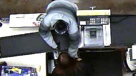 Deputies released surveillance camera photos of an armed man who robbed a Ralphs grocery store in San Clemente Tuesday, Dec. 18, 2012.