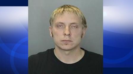 Joshua Evans, 33, a former teacher at El Rancho Charter School in Anaheim Hills, is shown in this booking photo.