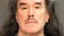 Larry Thomas Dominguez appears in a booking photo. He was arrested on suspicion of homicide after human bones were discovered on Sunday, Jan. 27, 2013, in the backyard of a Santa Ana home he previously owned.