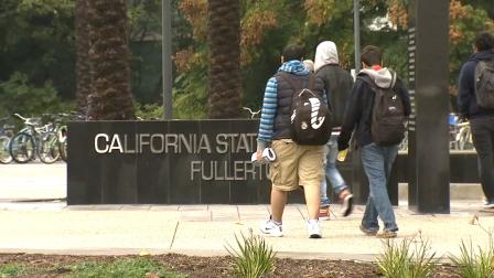 Students walk on the California State University, Fullerton, campus Tuesday, March 19, 2013.