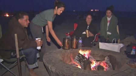 Beachgoers sit around a fire pit in this undated file photo.