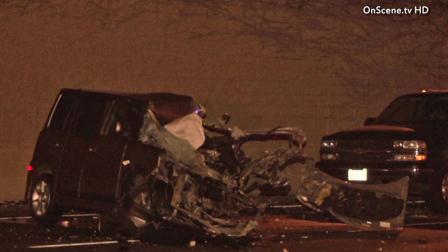 A wrecked car is shown at the scene of a wrong-way crash along the northbound lanes of Jamboree Road in Tustin on Thursday, April 11, 2013.