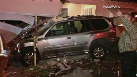 An SUV, seen above, slammed into a house in the 12000 block of Yorba Street near Tustin on Friday, April 26, 2013.