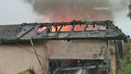 A business in the 800 block of North Elm Street erupted in flames on Thursday, May 9, 2013.