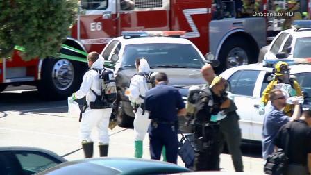 Police and a hazmat team investigate a letter with a suspicious substance found by a citizen Sunday, June 9, 2013.