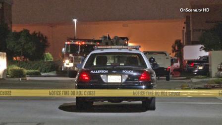 Fullerton police are seen at a clothing manufacturer in the 1400 block of East Valencia Drive on Wednesday, June 12, 2013, after reports of a man assaulting his boss. Police shot and killed the man after he returned to the scene with a gun.