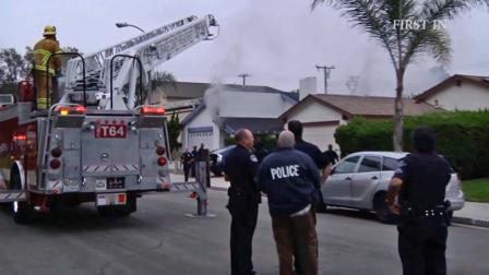 Firefighters and police respond to a fire at a home on the 11500 block of Panay Street in Cypress on Saturday, Aug. 3, 2013.
