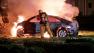 A firefighter douses a car engulfed in fire following a crash on Katella Avenue in the city of Orange on Saturday, Aug. 31, 2013.