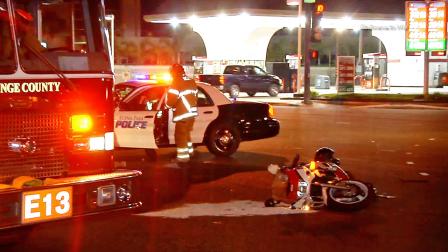 Police and fire officials are shown at the scene of a hit-and-run crash at Orangethorpe and Knott avenues in Buena Park on Tuesday, Sept. 3, 2013.