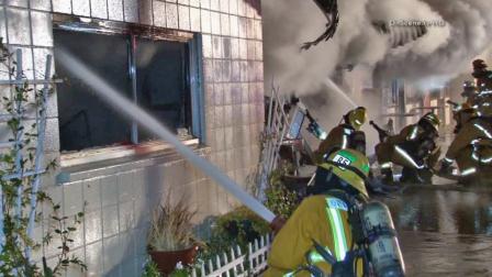 Firefighters battle a structure fire in the 700 block of Main Street in the city of Orange on Wednesday, Sept. 18, 2013.