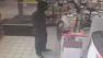 An image from surveillance video shows a suspect wanted in an armed robbery at a Shell gas station in Laguna Hills on Friday, Sept. 27, 2013.