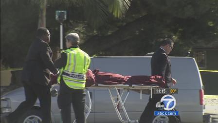 Police investigate after a mans body was found in the roadway in the city of Orange on Tuesday, Oct. 15, 2013.