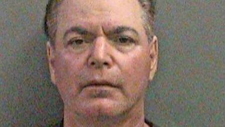Scott Ruvolo, 56, is shown in a booking photo. Ruvolo was arrested for allegedly attempting to record women changing in the dressing room in Fountain Valley.
