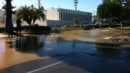 At about 10:31 a.m., officers responded to the area of Dyer and Halladay reference a sink hole forming and a water main breakage in Santa Ana on Thursday, November 14, 2013.