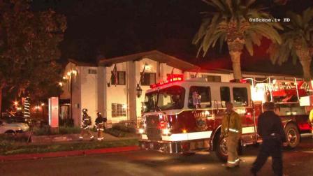 Firefighters are seen battling a blaze on the second floor of the Lemon Tree Inn in the 1600 block of East Lincoln Avenue in Anaheim Sunday, Nov. 17, 2013.