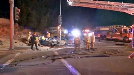 Crews at the scene of a violent car crash in Placentia that killed two people on Sunday, Dec. 15, 2013.